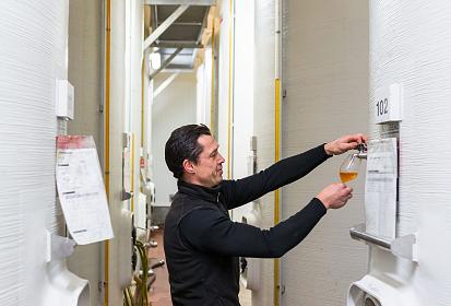 Joseph Jan monitors his ciders in the cidery